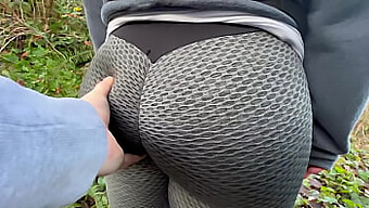 Close-Up Of A Busty Woman'S Feet And Butt In Public